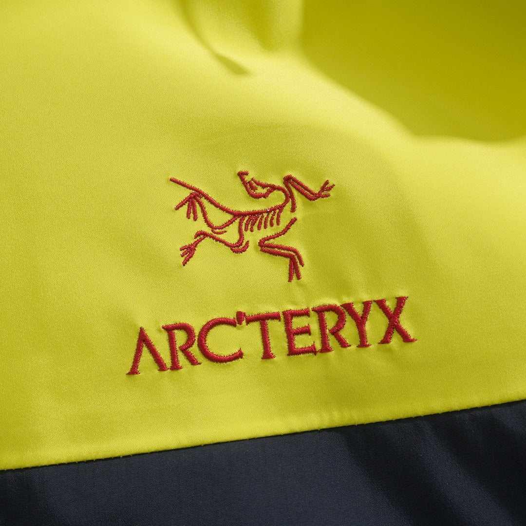 Arc'teryx Alpha SV Series Men's Hooded Waterproof Hardshell Jacket in "Yellow Navy"